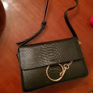 Black textured handbag